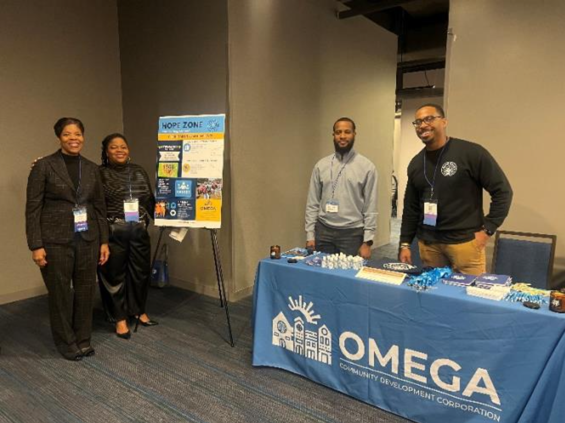 The Hope Zone Promise Neighborhoods team (Vanessa Ward, Rachel Ward, Jonathan Williams, and Sean Freeman) proudly represents Dayton, Ohio and the Omega Community Development Corporation during the Neighborhood Walk.